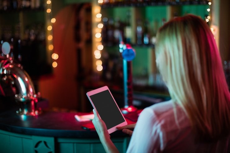 Mobile phone showing 25010 app interface with live sports betting and casino games
